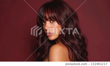 Chic woman with long hair poses 132461217