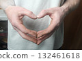 Men's hands are folded in a heart. Heart Symbol 132461618