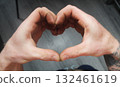 A man shows his heart with his hands. Heart Symbol 132461619
