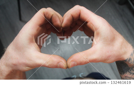 A man shows his heart with his hands. Heart Symbol A man shows his heart with his hands. Heart Symbol 132461619