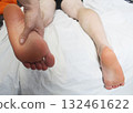 Foot massage on a white background 132461622