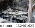 consequences of a car fire. The burned-out interior of the car was buried in the foam of a fire extinguisher 132461625