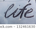 Word life on a white background of snow dust foam close-up 132461630