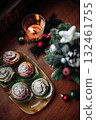 Christmas and New Year cupcakes on Christmas decorated table 132461755