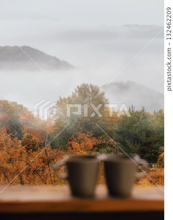 Foggy Autumn Morning with Two Coffee Cups Foggy Autumn Morning with Two Coffee Cups 132462209