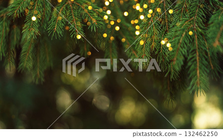 Green pine needles and glowing bokeh, elegant Christmas background 132462250