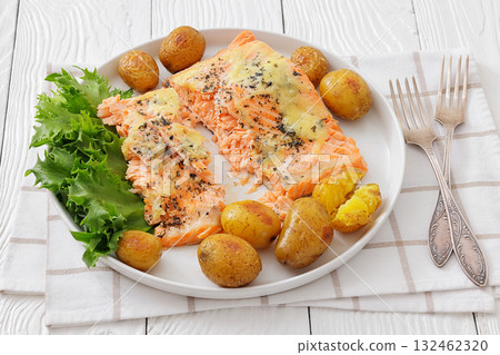 Salmon fillet with cheese, spices, baby potatoes Salmon fillet with cheese, spices, baby potatoes 132462320