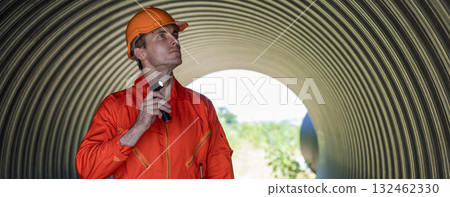 ndustry Engineers Walking Inside Circular water Pipe. Engineering or Worker inspection pipe ndustry Engineers Walking Inside Circular water Pipe. Engineering or Worker inspection pipe 132462330