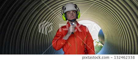 ndustry Engineers Walking Inside Circular water Pipe. Engineering or Worker inspection pipe ndustry Engineers Walking Inside Circular water Pipe. Engineering or Worker inspection pipe 132462338