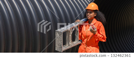 ndustry Engineers Walking Inside Circular water Pipe. Engineering or Worker inspection pipe  132462361