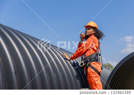 ndustry Engineers Walking Inside Circular water Pipe. Engineering or Worker inspection pipe  132462389