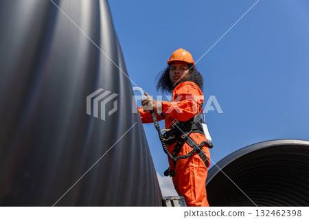 ndustry Engineers Walking Inside Circular water Pipe. Engineering or Worker inspection pipe  132462398