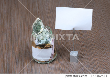 Money jar with note 132462511
