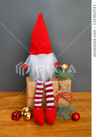 Christmas or New Year composition with a gnome, elf on a gray background 132462541