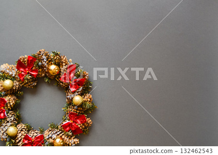 Christmas wreath on a dark gray background. Top view. Christmas wreath on a dark gray background. Top view. 132462543