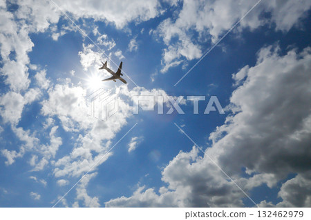 Sun, airplane and blue sky Sun, airplane and blue sky 132462979