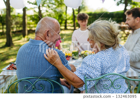 Grandparents at family garden party. Grandparents at family garden party. 132463095