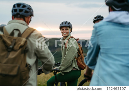 Happy woman during family biking adventure in nature. Happy woman during family biking adventure in nature. 132463107