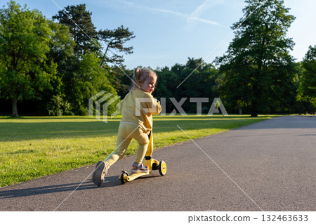 Preschool child scooter. Outdoor sport toddler. Fun play riding balance. Preschool child scooter. Outdoor sport toddler. Fun play riding balance. 132463633