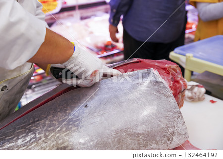 A craftsman carefully prepares fresh tuna A craftsman carefully prepares fresh tuna 132464192