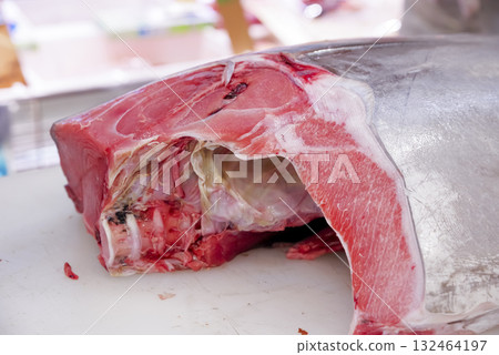A craftsman carefully prepares fresh tuna A craftsman carefully prepares fresh tuna 132464197