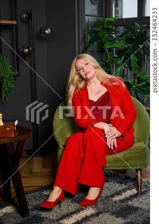 stylish woman pondering, creative woman with reflective gaze, caucasian woman in red executing stylish woman pondering, creative woman with reflective gaze, caucasian woman in red executing 132464233