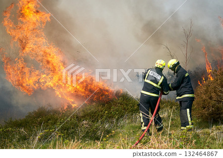Wildfires fire burning with a lot of smoke, firefighters Wildfires fire burning with a lot of smoke, firefighters 132464867