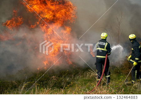 Wildfires fire burning with a lot of smoke, firefighters 132464883