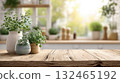 Fresh herbs in ceramic pots on a wooden kitchen table 132465192