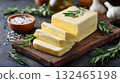 close-up of homemade herb butter on a wooden board 132465198