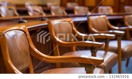 The jury box is a set of matching chairs arranged in a semicircle with each chair equipped with a small table for taking notes The jury box is a set of matching chairs arranged in a semicircle with each chair equipped with a small table for taking notes 132465916