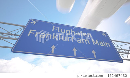 Detailed airport direction sign near Frankfurt am Main Airport with commercial jet arriving from the horizon, arriving to Frankfurt, Germany. 3D rendering 132467480