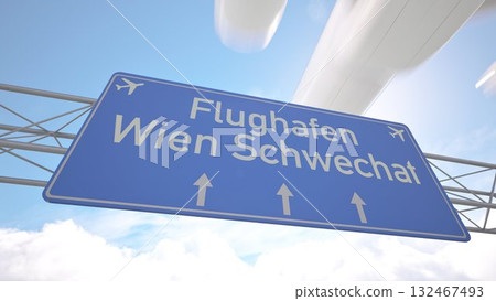 Highway marker pointing to Vienna Schwechat Airport with aircraft descending above the road, arriving to Vienna, Austria. 3D rendering 132467493