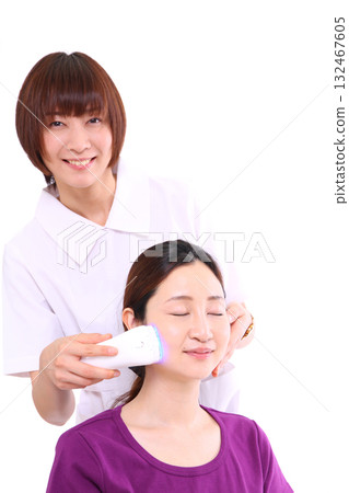 A woman receiving a beauty massage A woman receiving a beauty massage 132467605
