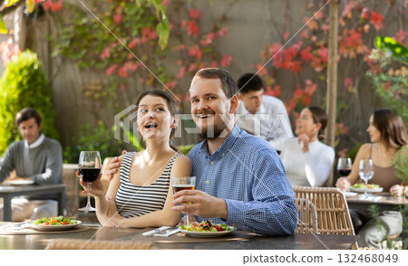 Couple man and woman eating and talking in restaurant Couple man and woman eating and talking in restaurant 132468049