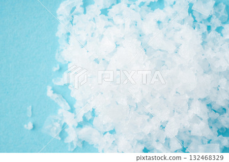 Close-up of coarse salt on a light blue background 132468329