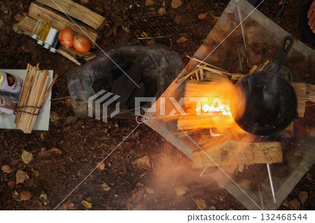 Camping cooking over a bonfire and skillet 132468544