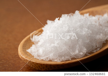 Close-up of coarse salt on a wooden spoon 132468681