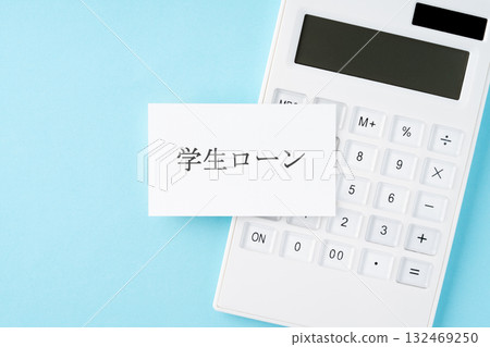 Student loan text and calculator on light blue background 132469250