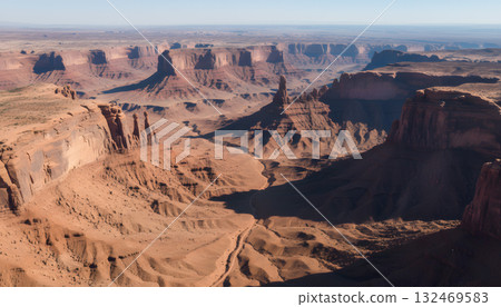Aerial view of towering desert buttes and canyons 132469583
