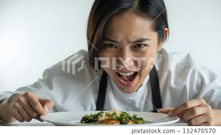 Chef Expressing Frustration Over Dish Presentation in Professional Kitchen Setting Chef Expressing Frustration Over Dish Presentation in Professional Kitchen Setting 132470570