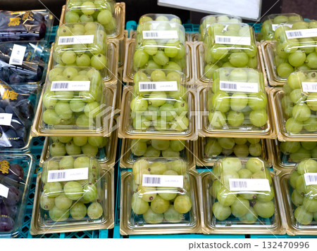 Shine Muscat grapes lined up in a store 132470996