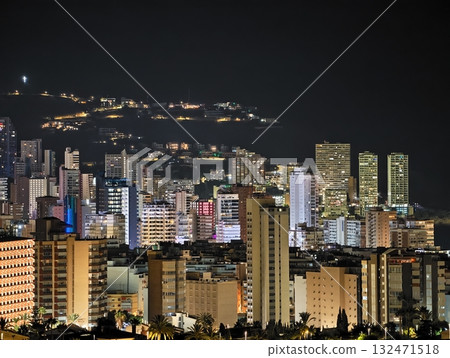 night city lights, nighttime city skyline sparkles as ferries streak across shadowy water surface night city lights, nighttime city skyline sparkles as ferries streak across shadowy water surface 132471518