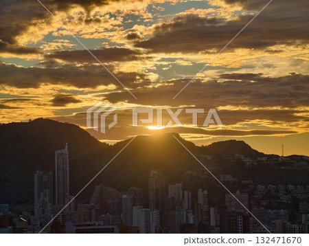 sunset paints urban silhouettes vividly, warm tones and striking clouds create captivating urban sunset paints urban silhouettes vividly, warm tones and striking clouds create captivating urban 132471670