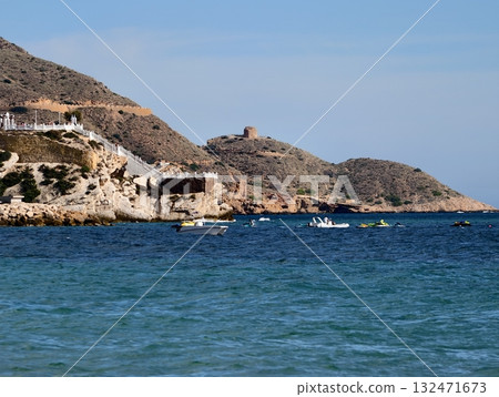 calm harbor with boats nearby, sunny headland dotted with vessels and lively seaside atmosphere calm harbor with boats nearby, sunny headland dotted with vessels and lively seaside atmosphere 132471673