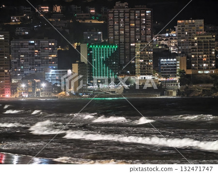 luminous skyline with diverse architecture reflected in tranquil waters during lively nocturnal 132471747