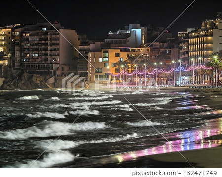 luminous skyline with diverse architecture reflected in tranquil waters during lively nocturnal 132471749