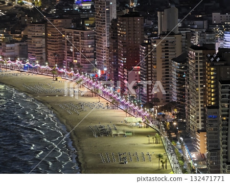 luminous skyline with diverse architecture reflected in tranquil waters during lively nocturnal 132471771