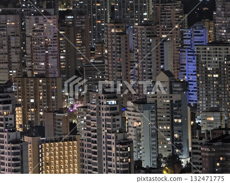 luminous skyline with diverse architecture reflected in tranquil waters during lively nocturnal 132471775