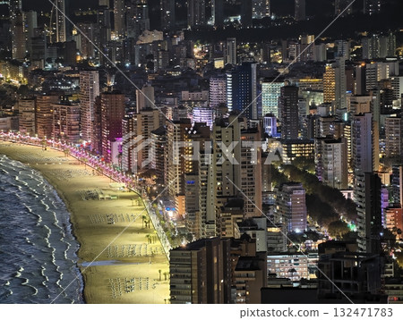 luminous skyline with diverse architecture reflected in tranquil waters during lively nocturnal 132471783